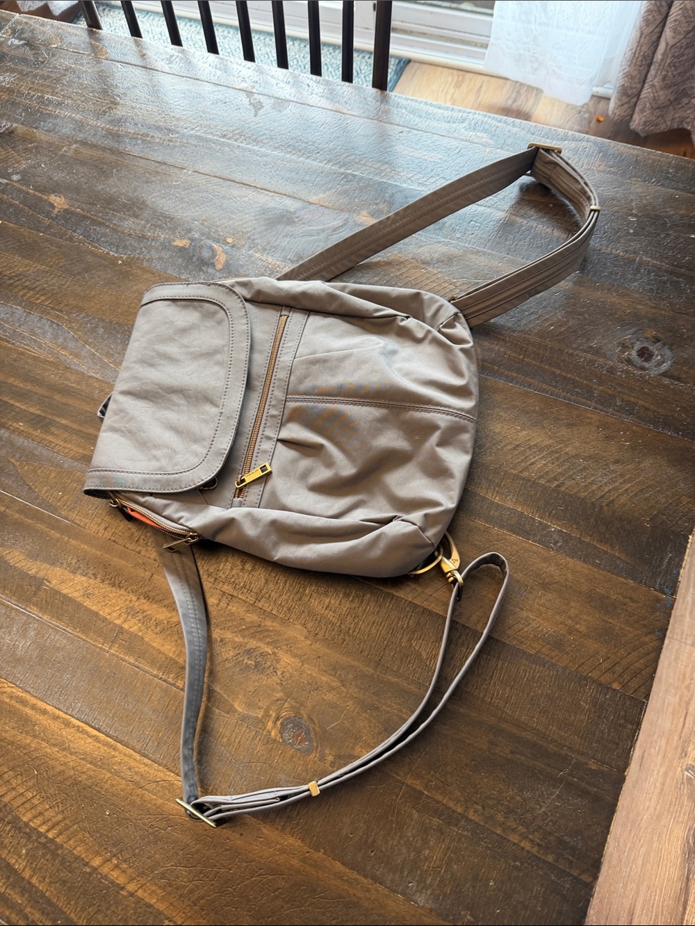 TravelOn anti-theft slim backpack. Gray with coral inside